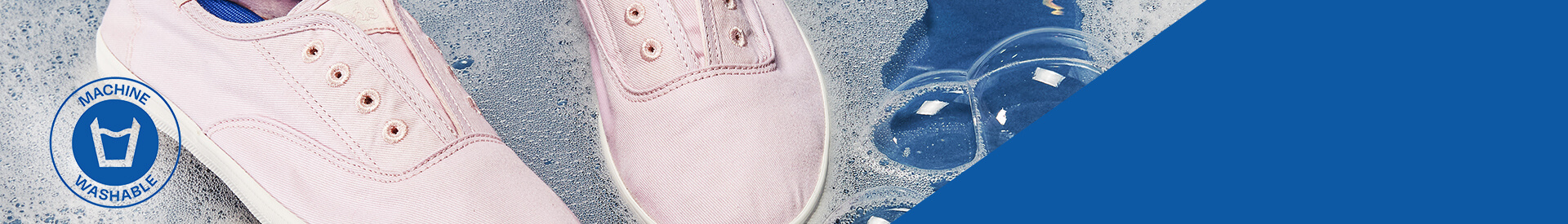 Machine washable icon with pink Keds Washable Sneakers in soapy suds.